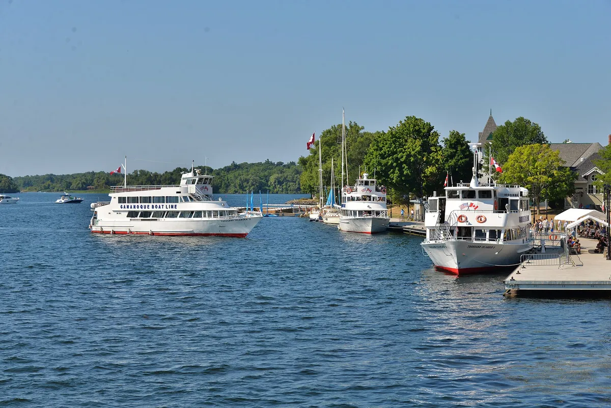 Triple-decker sightseeing boat leaving the dock at the start of a Gananoque boat tour on the 1000 Islands, Ontario