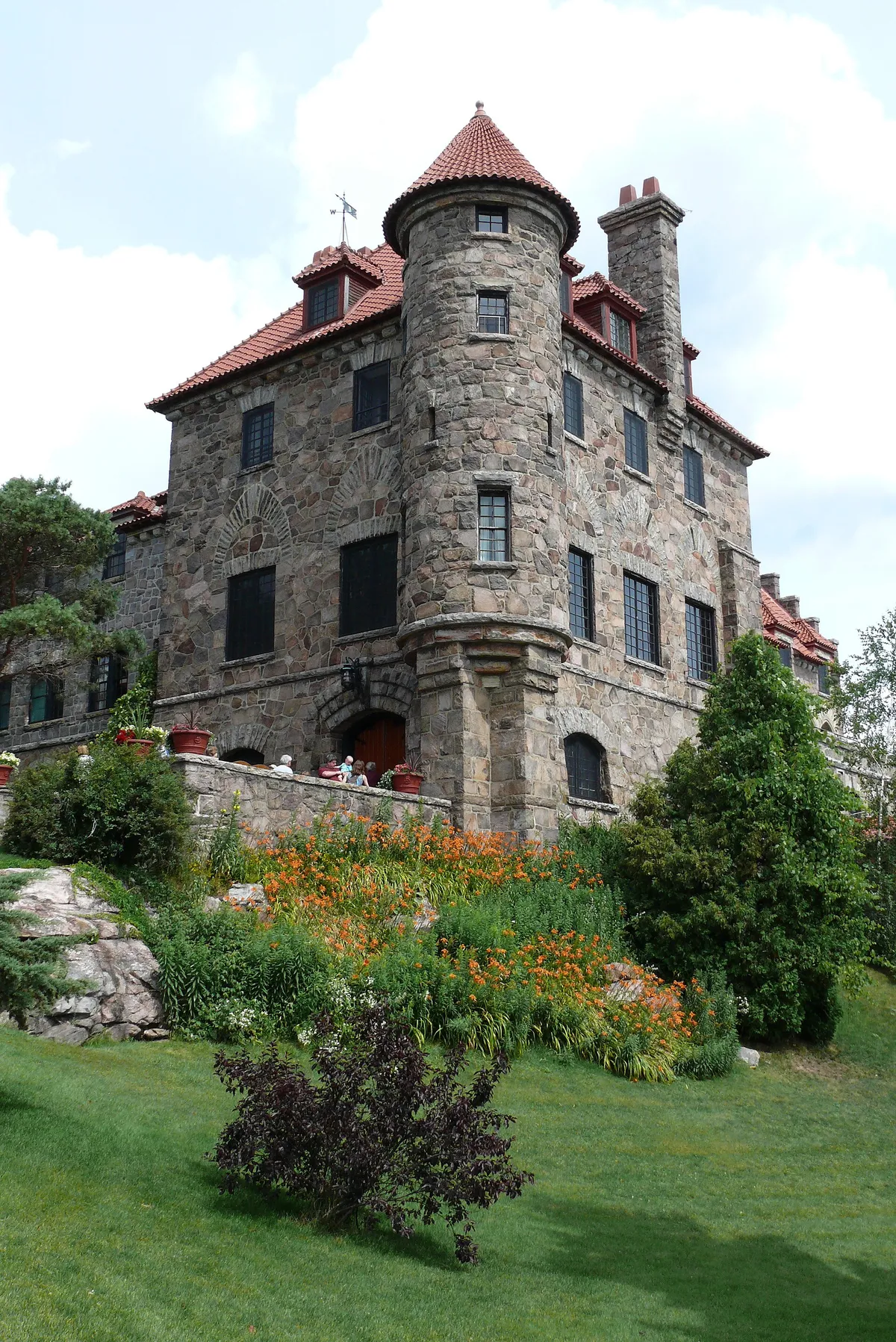 Singer Castle on Dark Island framed by pine-covered islets on a Gananoque boat tour 1000 Islands scenic cruise, Ontario